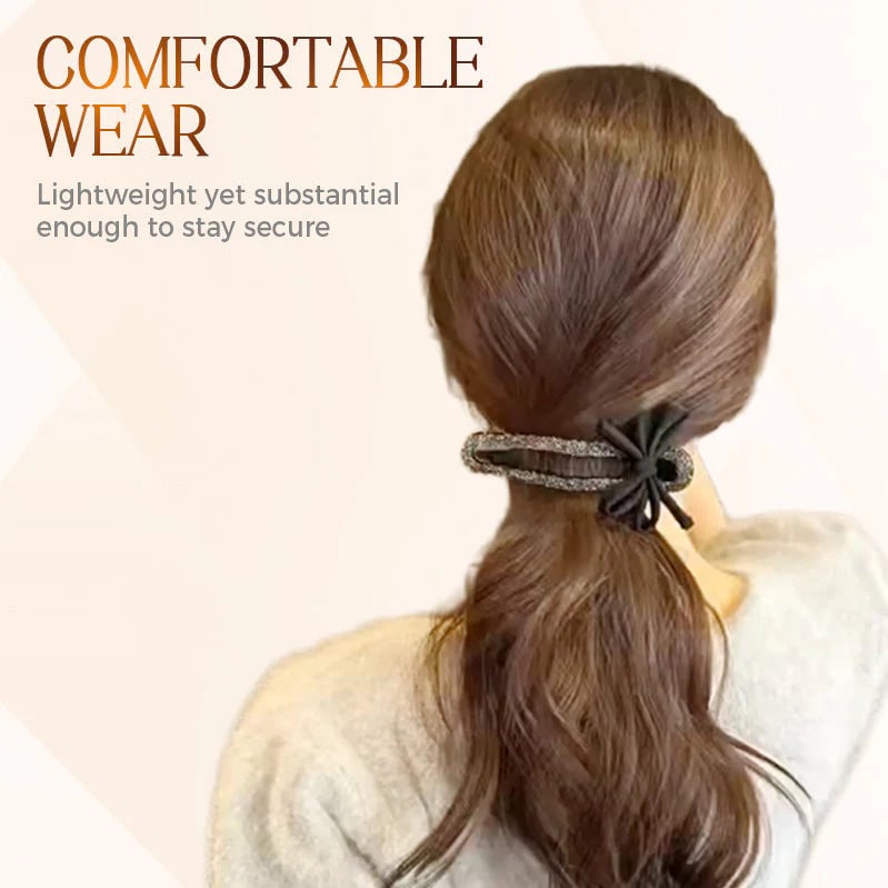 Glittrande elegant svart hårspänne med rosett