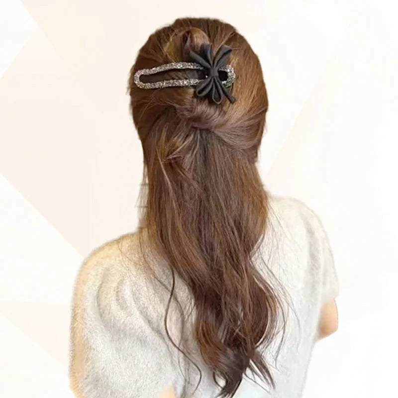 Glittrande elegant svart hårspänne med rosett